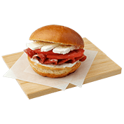 Brioche with air-dried salami, feta cheese, tomato and mayonnaise.