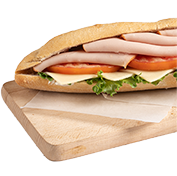 White baguette with smoked turkey, edam cheese, mayonnaise, tomato and green lola