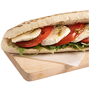 Panini with pesto, fresh mozzarella, arugula and tomato