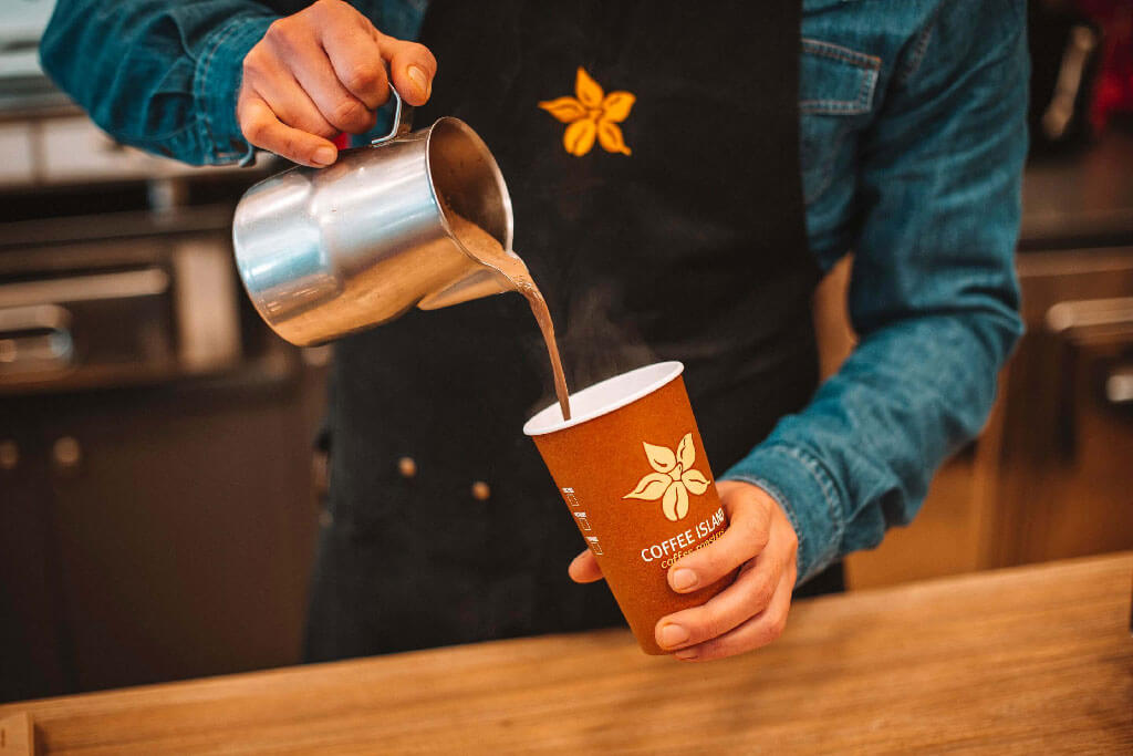 barista serving hot chocolate