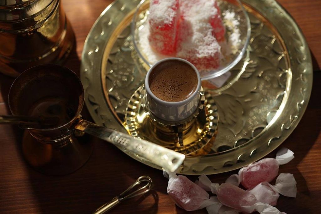 greek coffee on a tray with candies