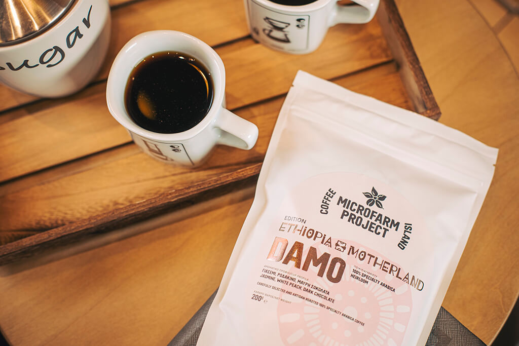 Mug and Ethiopia Damo package on a table. 