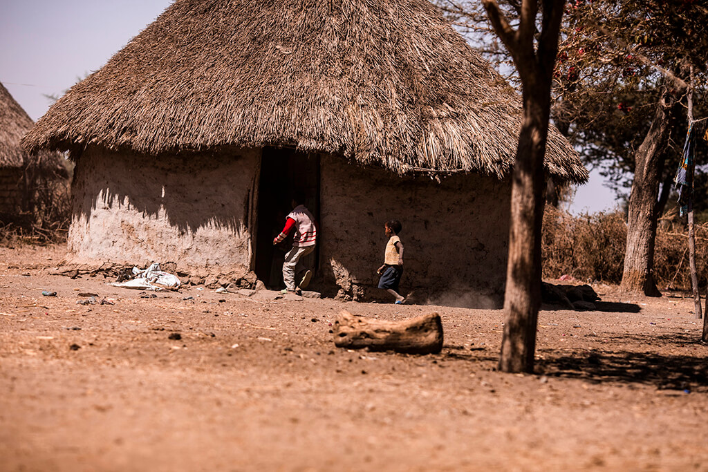 Kids playing outside a hut in Ethiopia