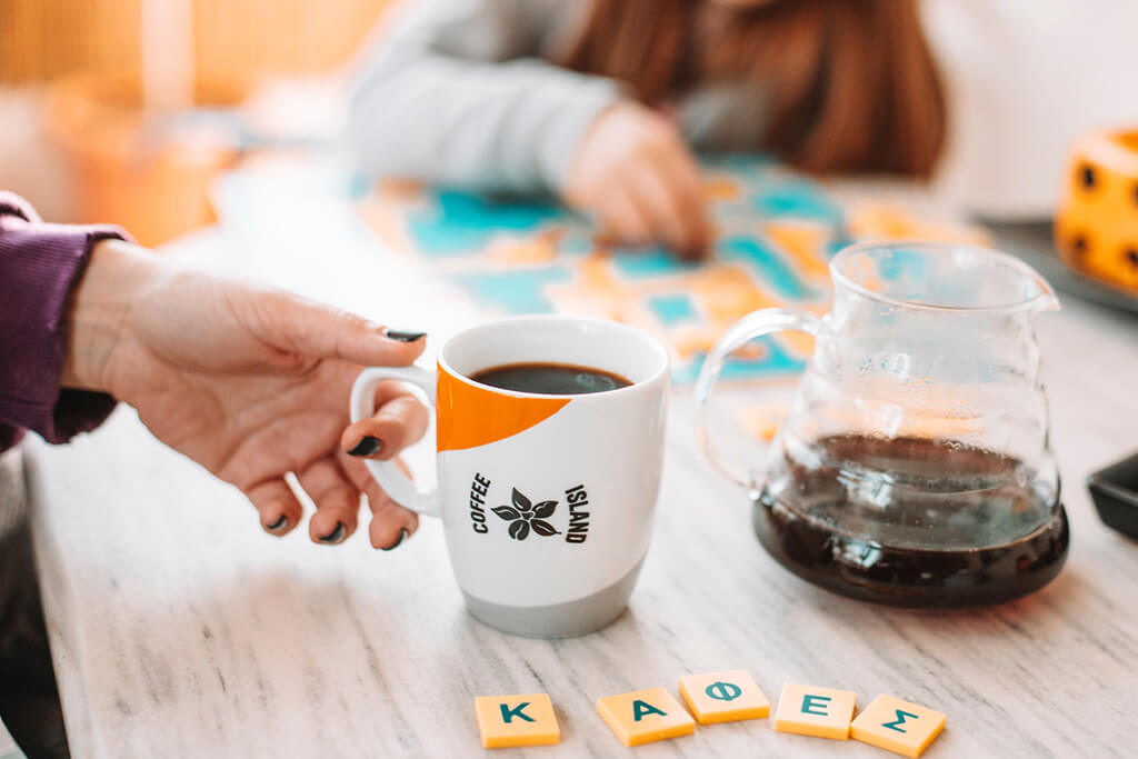 Playing games and enjoying Coffee Island's coffee at home