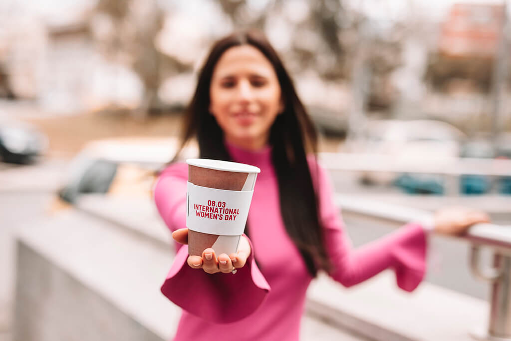 Coffee Island's International Women's Day coffee sleeve.