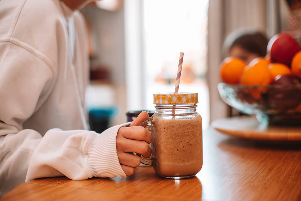 A woman enjoying her homemade Coffee Island instant coffee.