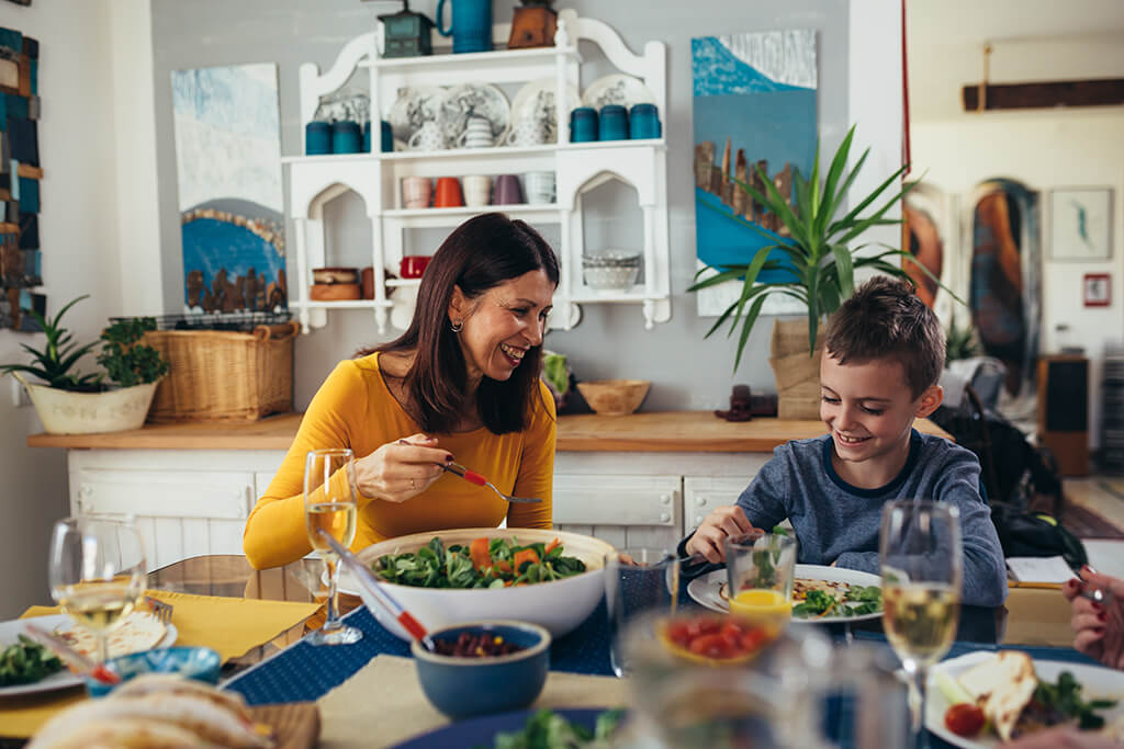 A mother and a son enjoying their lunch.