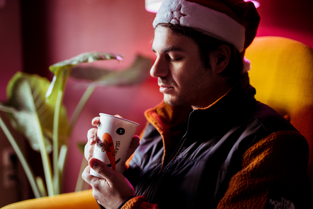 A man enjoying Coffee Island's Christmas beverage.