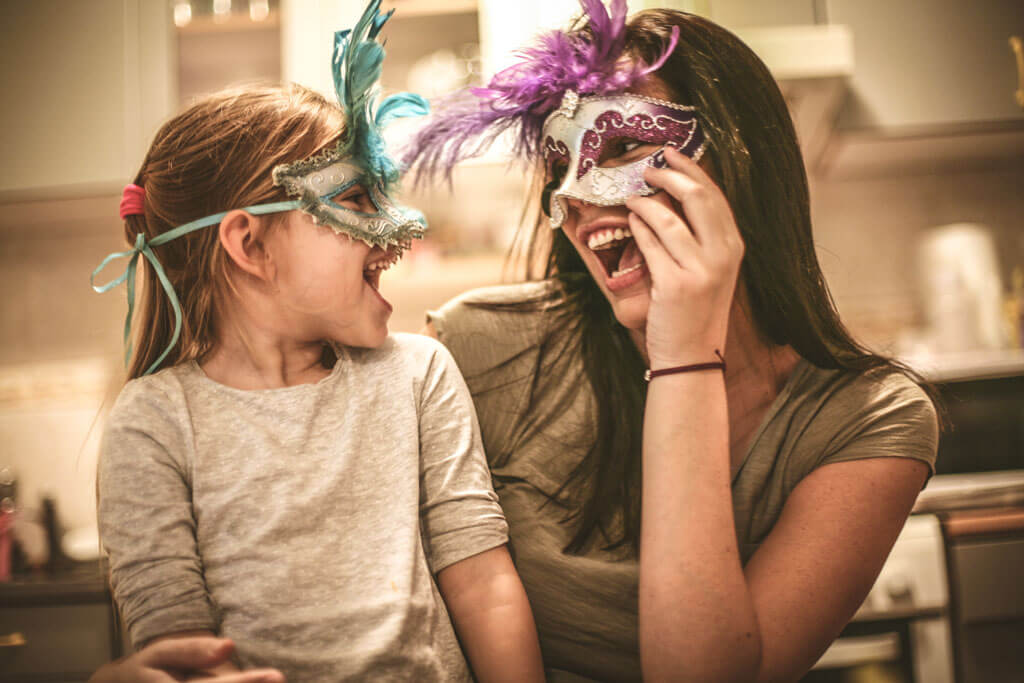 A woman and a child enjoying carnival.