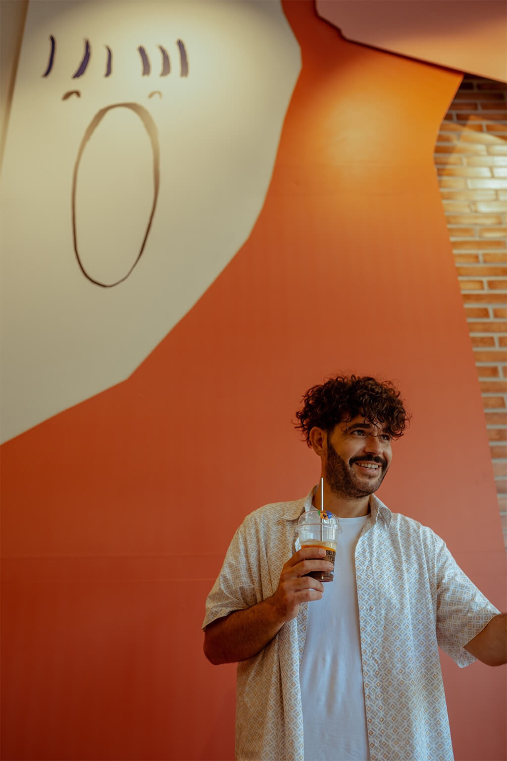 MAN HOLDING HIS CUP OF COFFEE