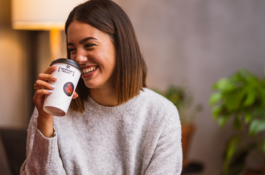 Woman smiling with coffee