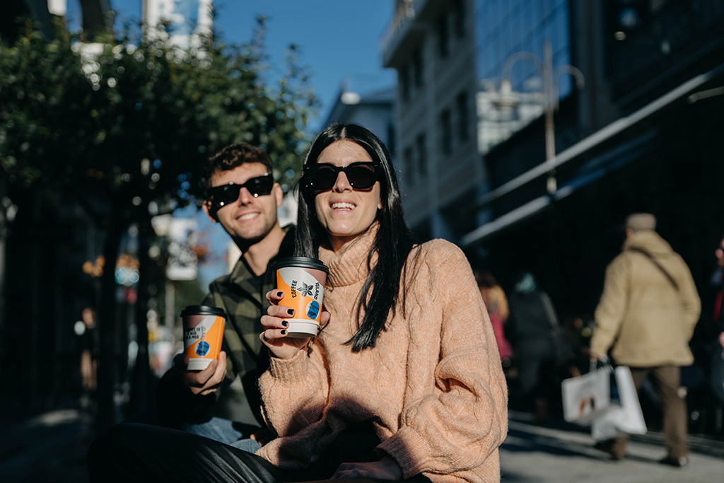 Happy people smiling with coffee