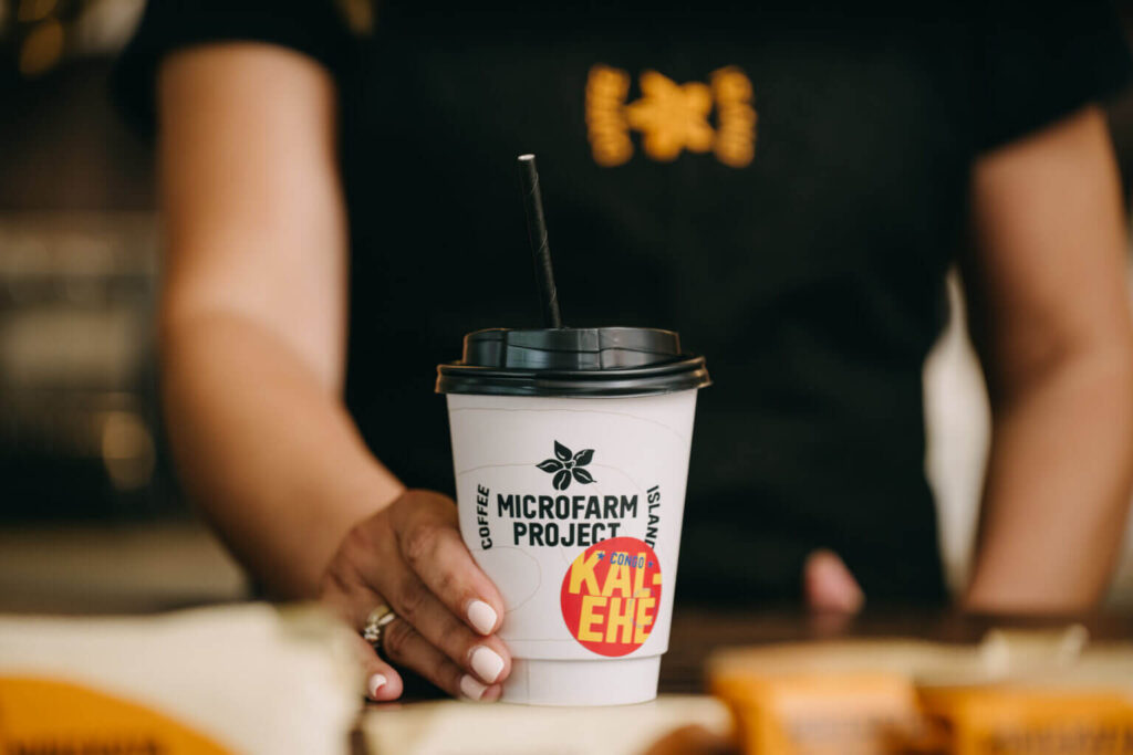 Barista serves coffee