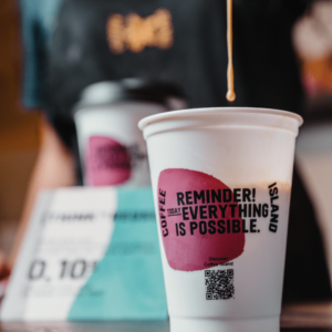 Cup of coffee in the hand of a barista